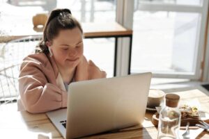 Young woman with disability studying