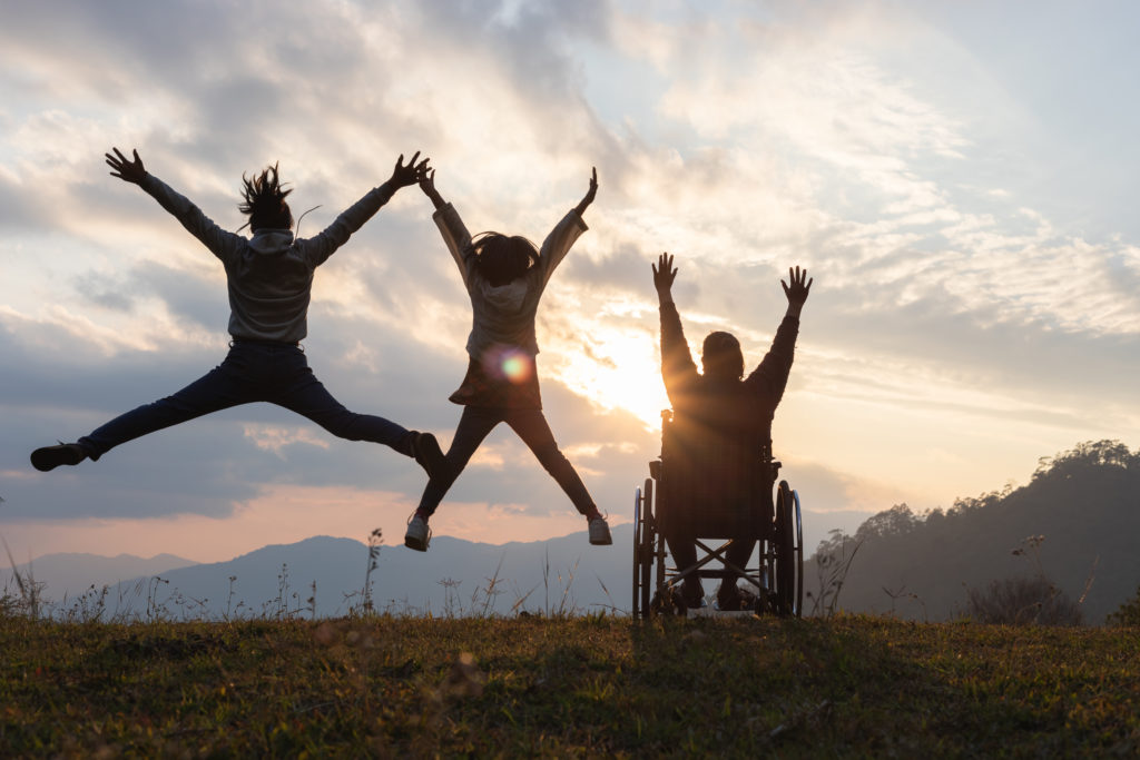 Silhouette,Disabled,Handicapped,Woman,In,Wheelchair,With,Raised,Arms,And