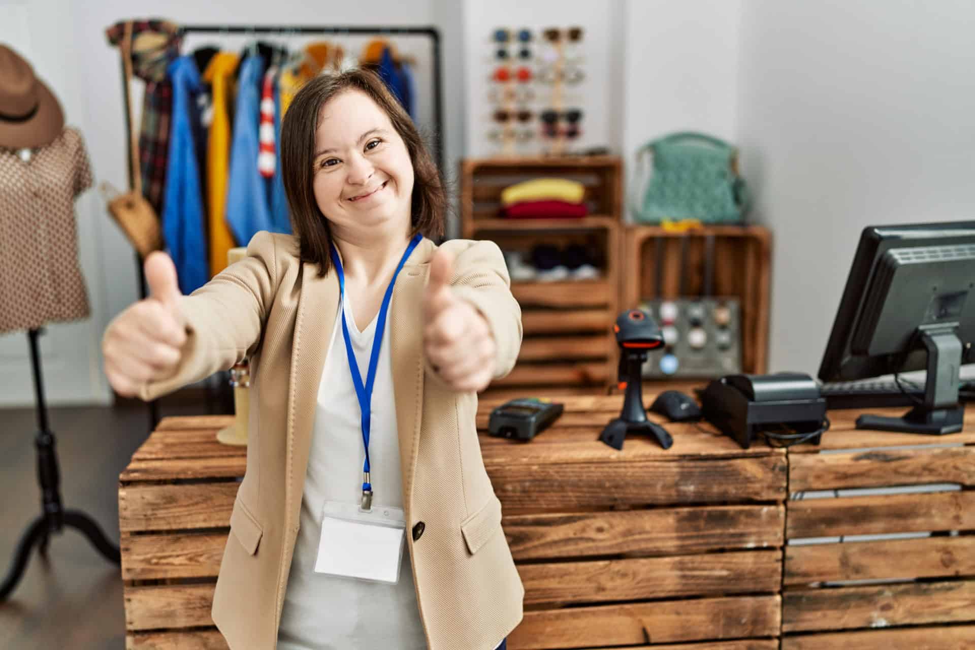 Young,Down,Syndrome,Woman,Working,As,Manager,At,Retail,Boutique